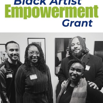 The text, "Black Artist Empowerment Grant," is shown above a black-and-white photo of four Black artists