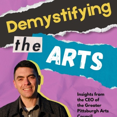 A cut-out photo of a smiling white man with short brown hair is placed on top of a purple background and text placed on cut-out pieces of paper reading, Demystifying the Arts: Insights from the CEO of the Greater Pittsburgh Arts Council.